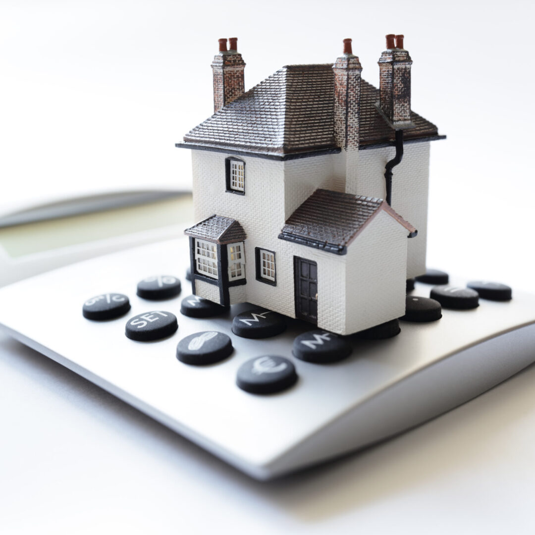 house-model-on-calculator-illustrating-home-financ-2026-03-09-05-47-44-utc-scaled.jpg